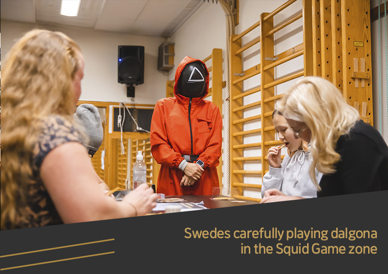 Swedes carefully playing dalgona in the Squid Game zone